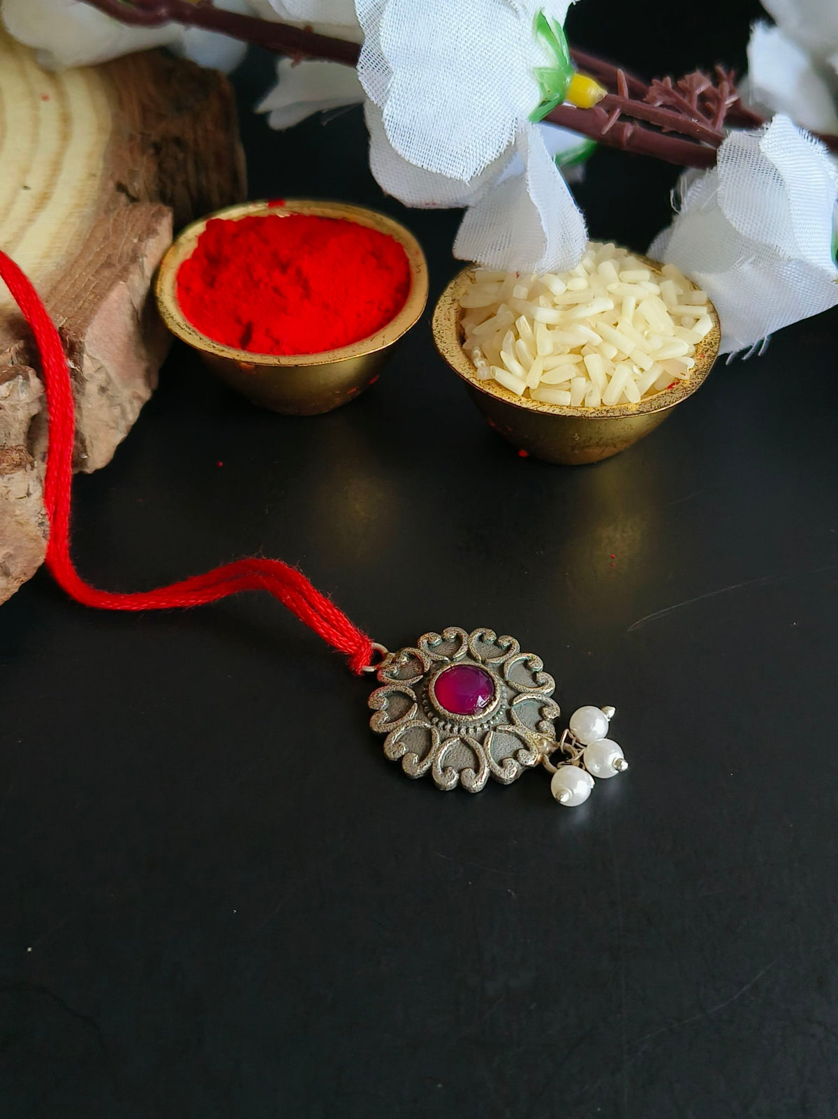 Floral Charm Lumba Rakhi with Red Stone Drop | Dynamic Jewelove