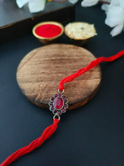 Red Stone Oval Rakhi in Silver Finish | Dynamic Jewelove
